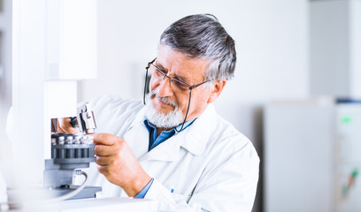 Wall Mural - senior male researcher carrying out scientific research in a lab