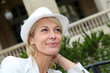 © goodluz - Portrait of beautiful middle-aged woman wearing hat