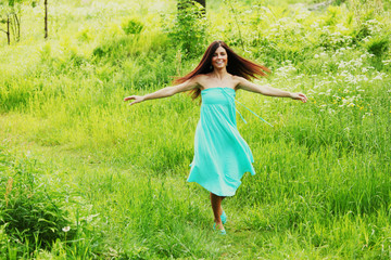 Beautiful Healthy Woman over Nature background