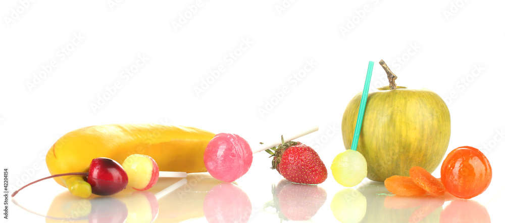 A lot of tasty lollipops with fruit isolated on white