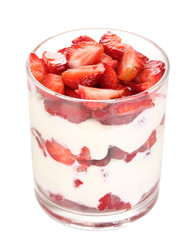 Fototapete - Glass of ripe strawberries with cream isolated on white