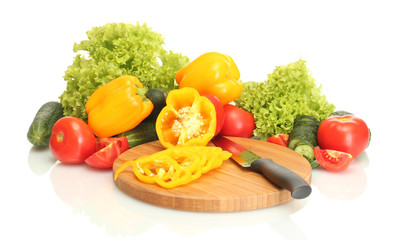 Wall Mural - vegetables and knife on cutting board isolated on white