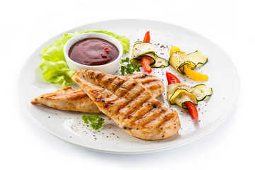 Grilled chicken breasts and vegetables