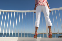 Sexy Womans Legs At Ocean Lookout Background