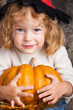 © Sunny studio - Child with big pumpkin