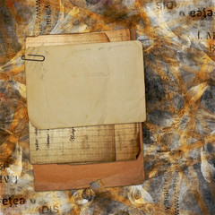 Old archive with letters, photos on the abstract grunge backgrou