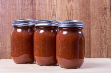 Wall Mural - Three jars of homemade tomato sauce