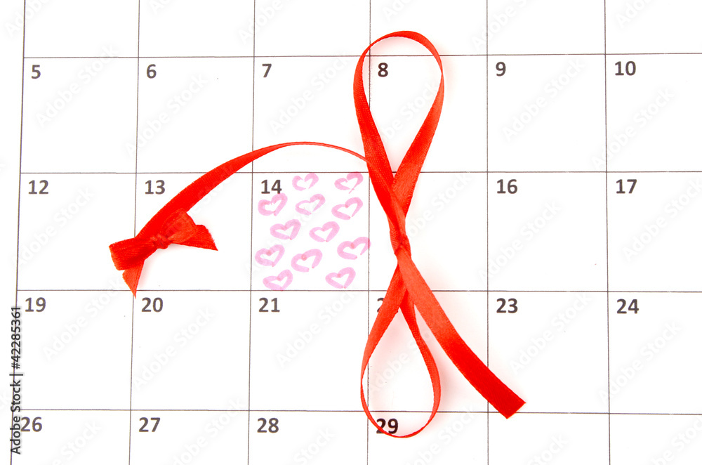 Calendar page with hearts and bows on St.Valentines Day