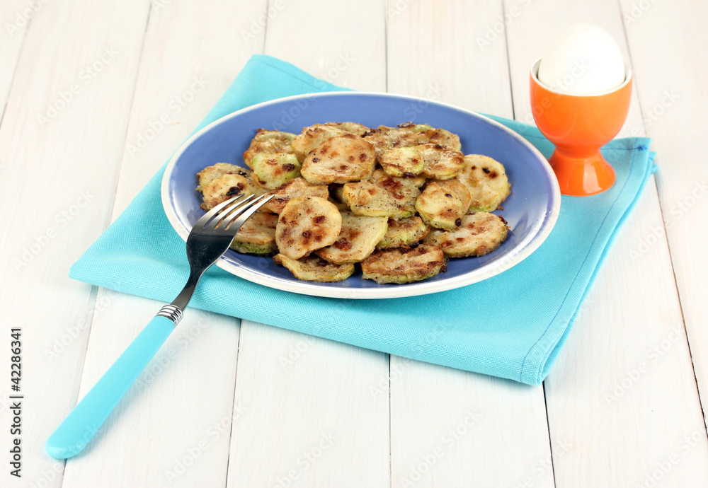 roasted squash in a blue bowl with the egg for breakfast