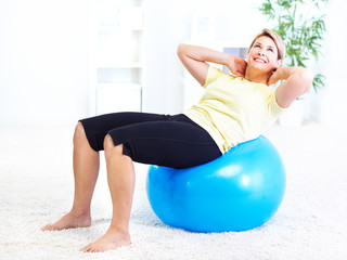 Canvas Print - Senior woman doing yoga.