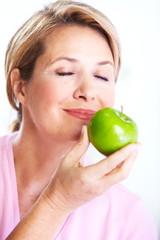 Canvas Print - Senior woman with apple. Diet.