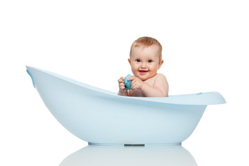 Girl in blue bath tub on white background