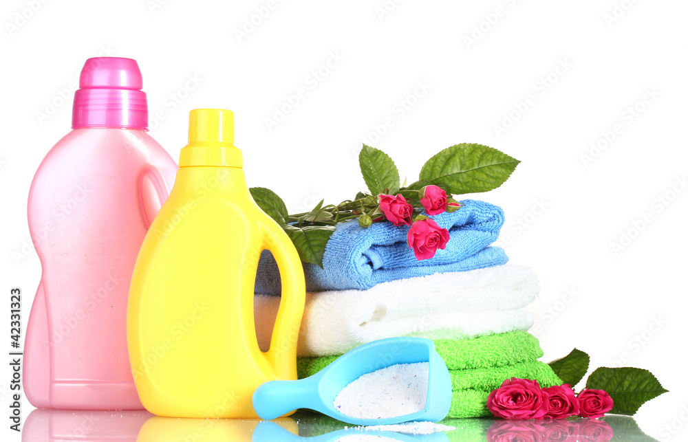 Detergent with washing powder and towels isolated on white