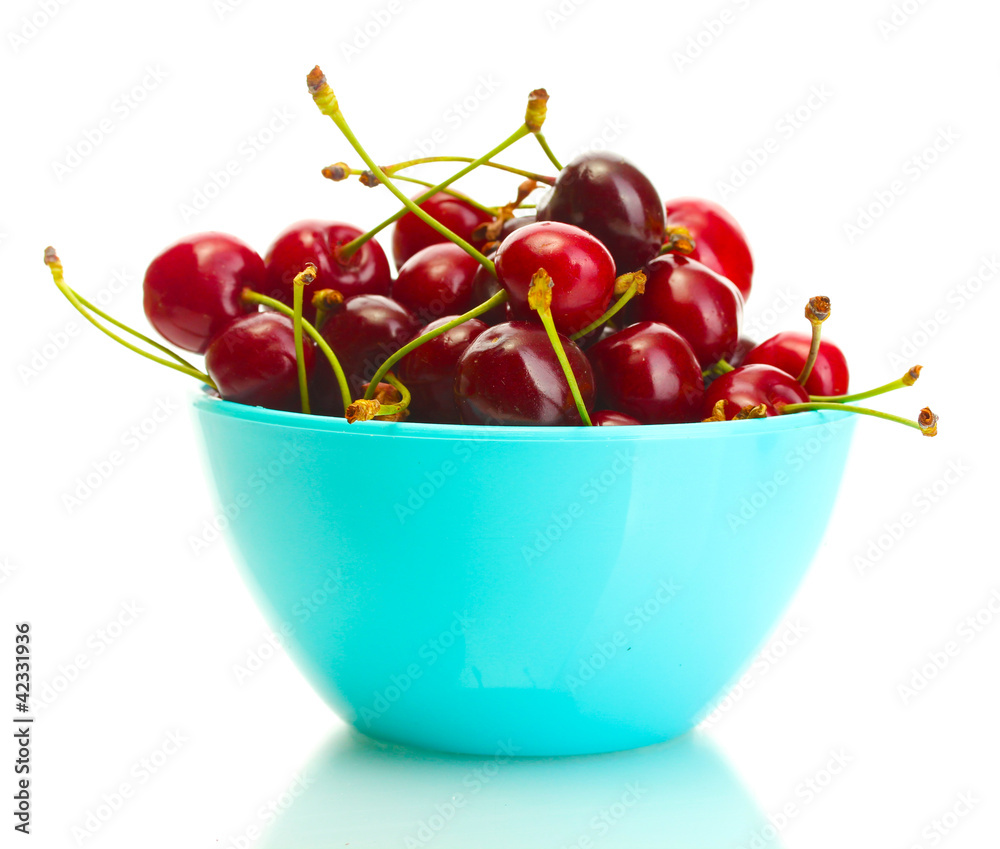 Ripe cherry berries in bowl isolated on white