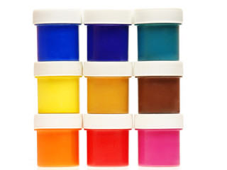 Multi-colored gouache paint isolated on a white background