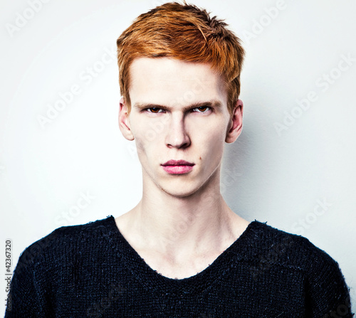 Nowoczesny obraz na płótnie Young red haired man on light background.