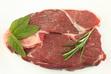 Wall Mural - Raw Lamb steak with mint and Rosemary