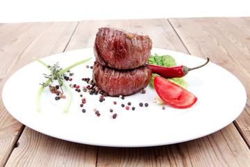 Wall Mural - beef fillet pieces on wood