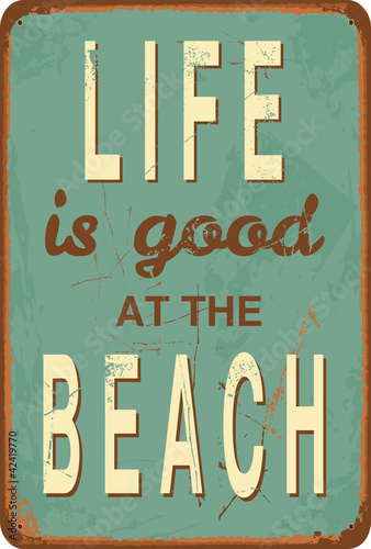 Photo Vintage style tin sign with text Life is good at the Beach.