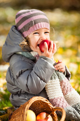 Wall Mural - Child eating red apple