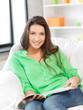 © Syda Productions - happy and smiling woman with magazine