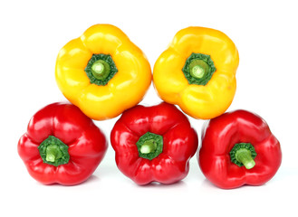 red and yellow paprika isolated on white.