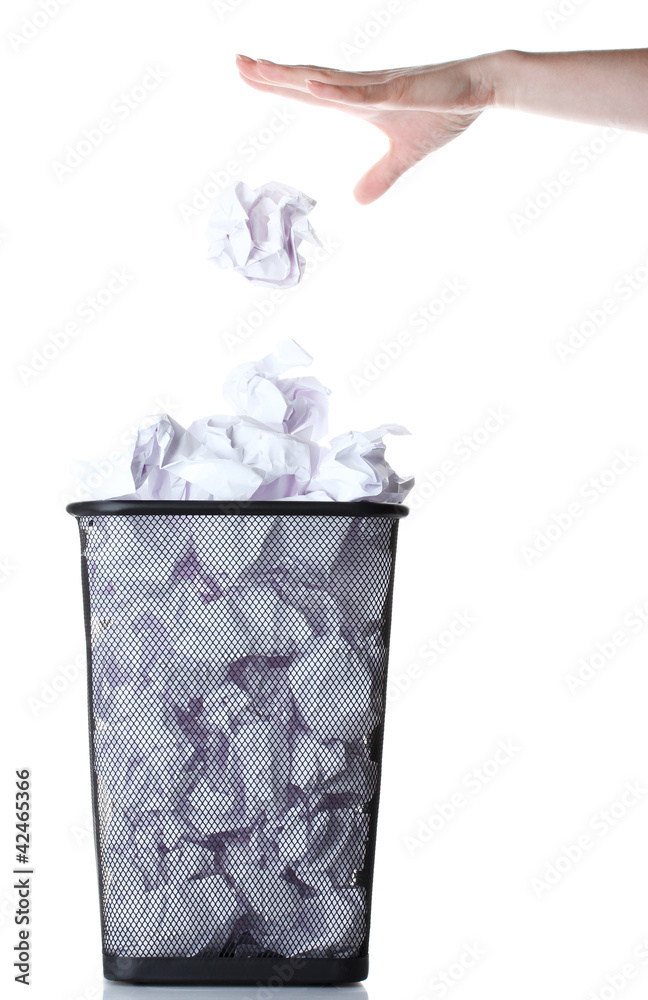 hand going garbage in metal trash bin from paper isolated