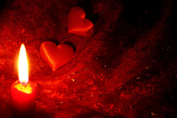 red candle and hearts abstracy background in night