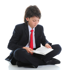 Wall Mural - little boy reading a book