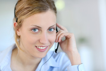 Wall Mural - Closeup of attractive blond customer service assistant