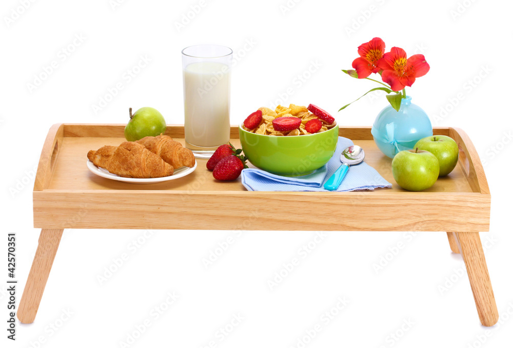 light breakfast on wooden tray isolated on white