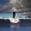 © Sergey Nivens - Young business person surfing on the waves