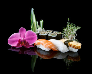 Wall Mural - sushi over black background