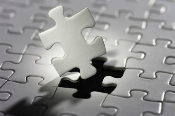 Aufkleber - Puzzle piece in spot light.