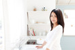 © taka - a young asian woman in the kitchen