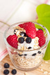 Muesli with yogurt raspberries and blueberries for breakfast