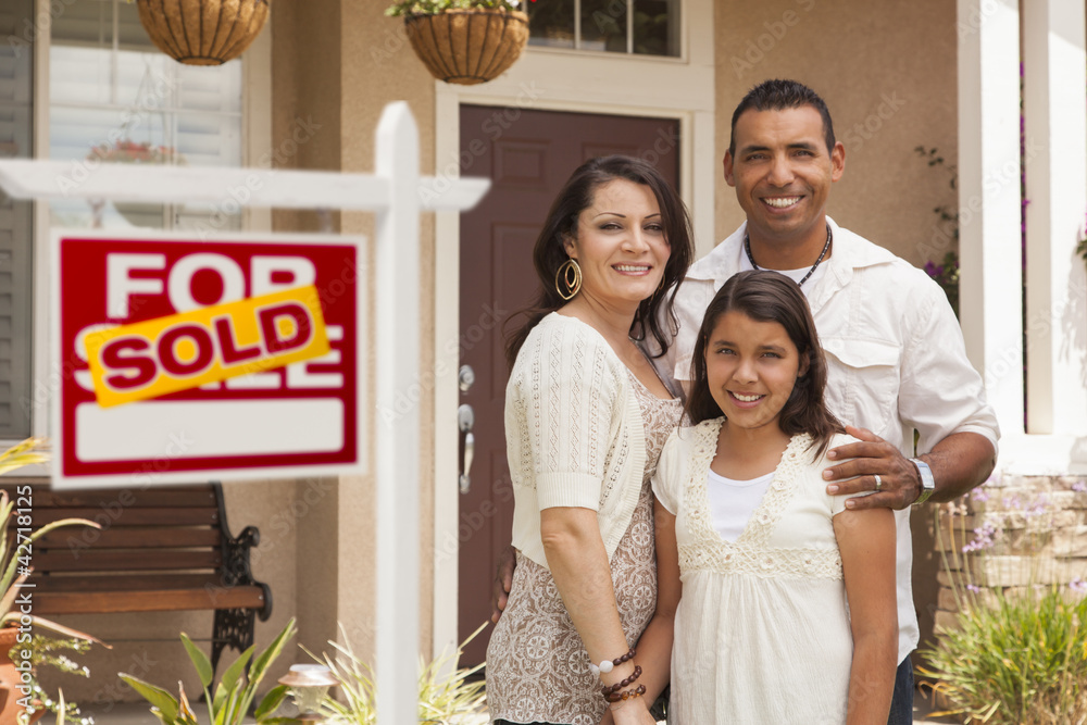 Hispanic Family in Front of Their New Home with Sold Sign Stock Photo ...