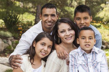 Wall Mural - Happy Attractive Hispanic Family Portrait In the Park