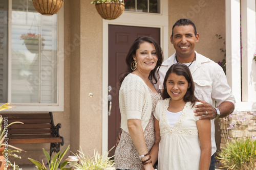 Fotografie, Obraz Small Hispanic Family in Front of Their Home
