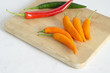 red pepper and Green Pepper on wooden board