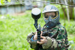 © Pavel Losevsky - Paintball player in camouflage uniform and protective mask poses