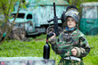 © Pavel Losevsky - Boy in the camouflage suit holds a paintball gun barrel up