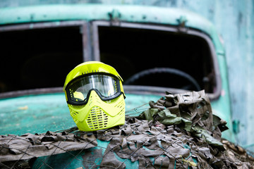 Wall Mural - Yellow protective mask for paintball players lies