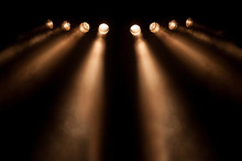 Eight Divergent Spotlights At Night