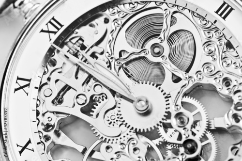 Naklejka - mata magnetyczna na lodówkę black and white close view of watch mechanism