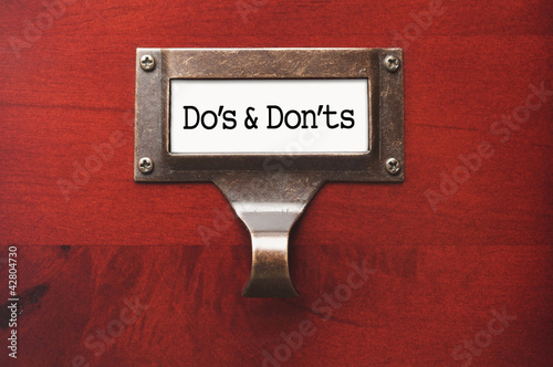 Lustrous Wooden Cabinet with Do's and Don'ts File Label Poster
