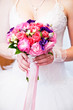 A bride holding her wedding bouquet