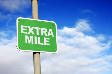 Green extra mile sign
