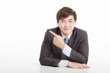 Wall Mural - asian young businessman pointing