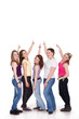 © luckybusiness - Group of girls pointing to copy